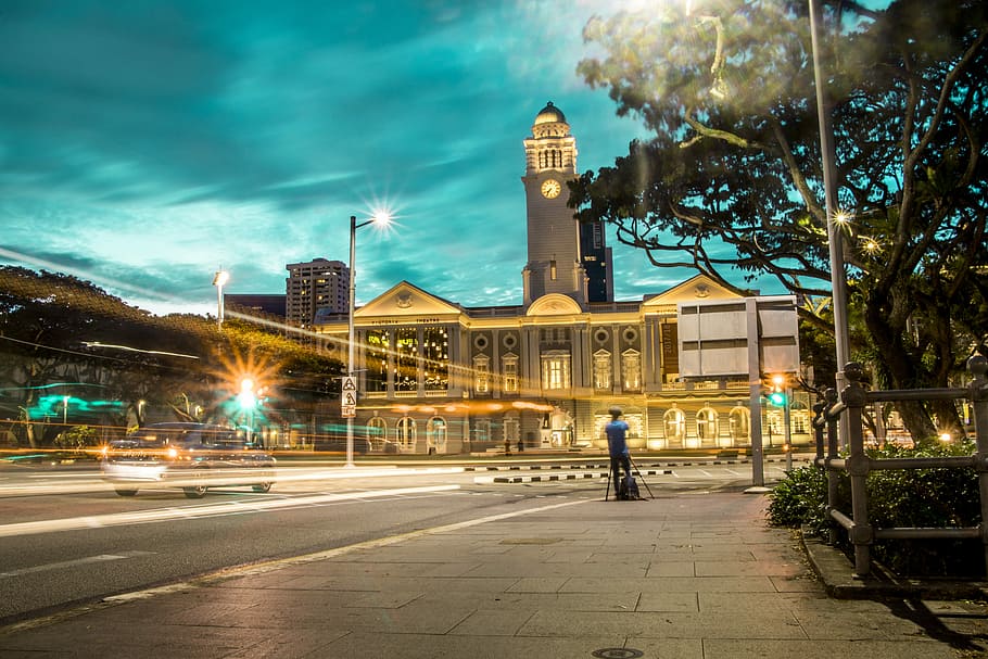 time lapse photography of a highway near church, concrete building HD wallpaper