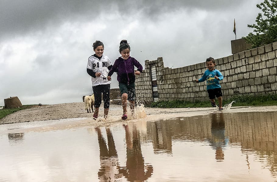 toddler running on flood, water, puddle, paddling, wall, cloud - sky HD wallpaper