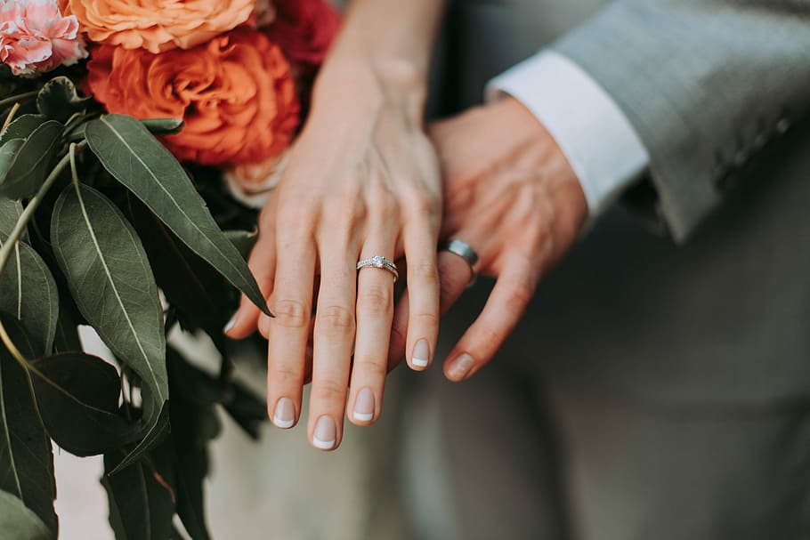 couple wearing silver-colored rings, two hands wearing rings HD wallpaper
