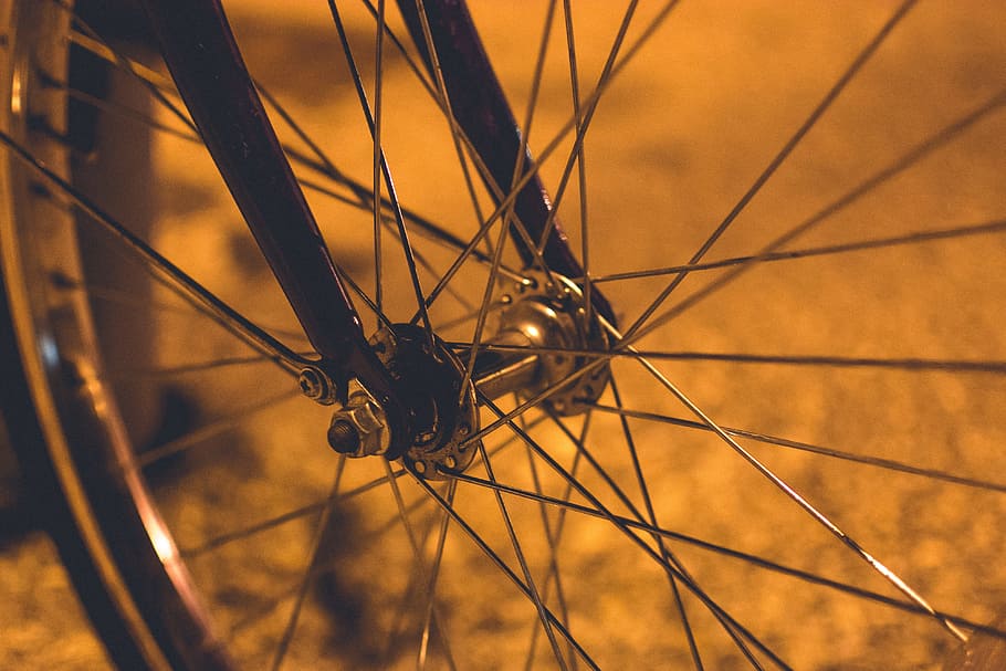 silver bicycle wheel, gray steel bicycle rim and black fork, grass HD wallpaper