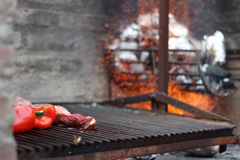 red bell pepper on grill, closeup photo of 'electric grille, Argentinian
