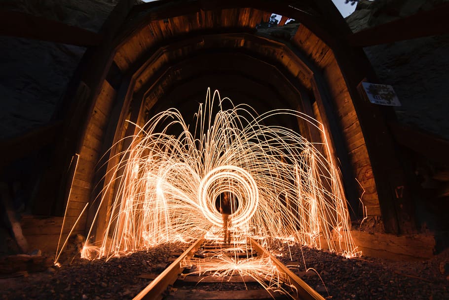 steel wool photography of railways under tunnel, still, fireworks HD wallpaper