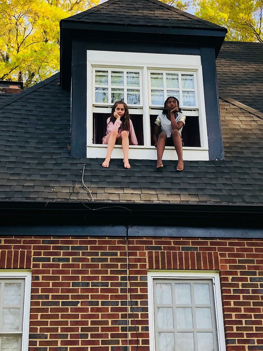 two girls sitting on white 2-panel windows during daytime, two girl on balcony window HD wallpaper