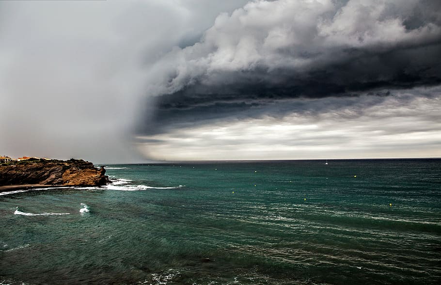 body of water under cloudy sky, sea, grey clouds, cloud - sky HD wallpaper