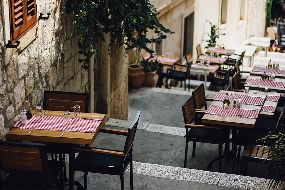 brown wooden tables along the street during daytime, chairs HD wallpaper