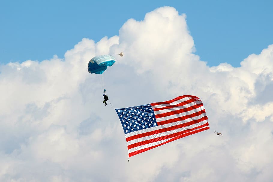 person skydiving with flag of USA during daytime, parachute HD wallpaper