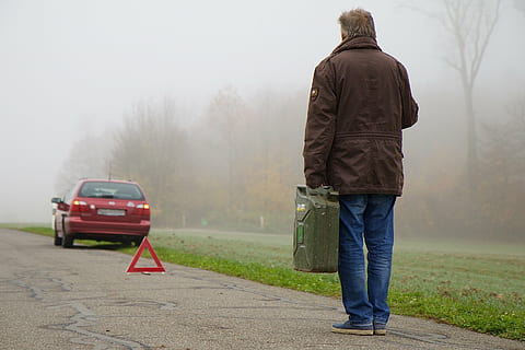 person standing holding gasoline container, vehicle, breakdown triangle HD wallpaper