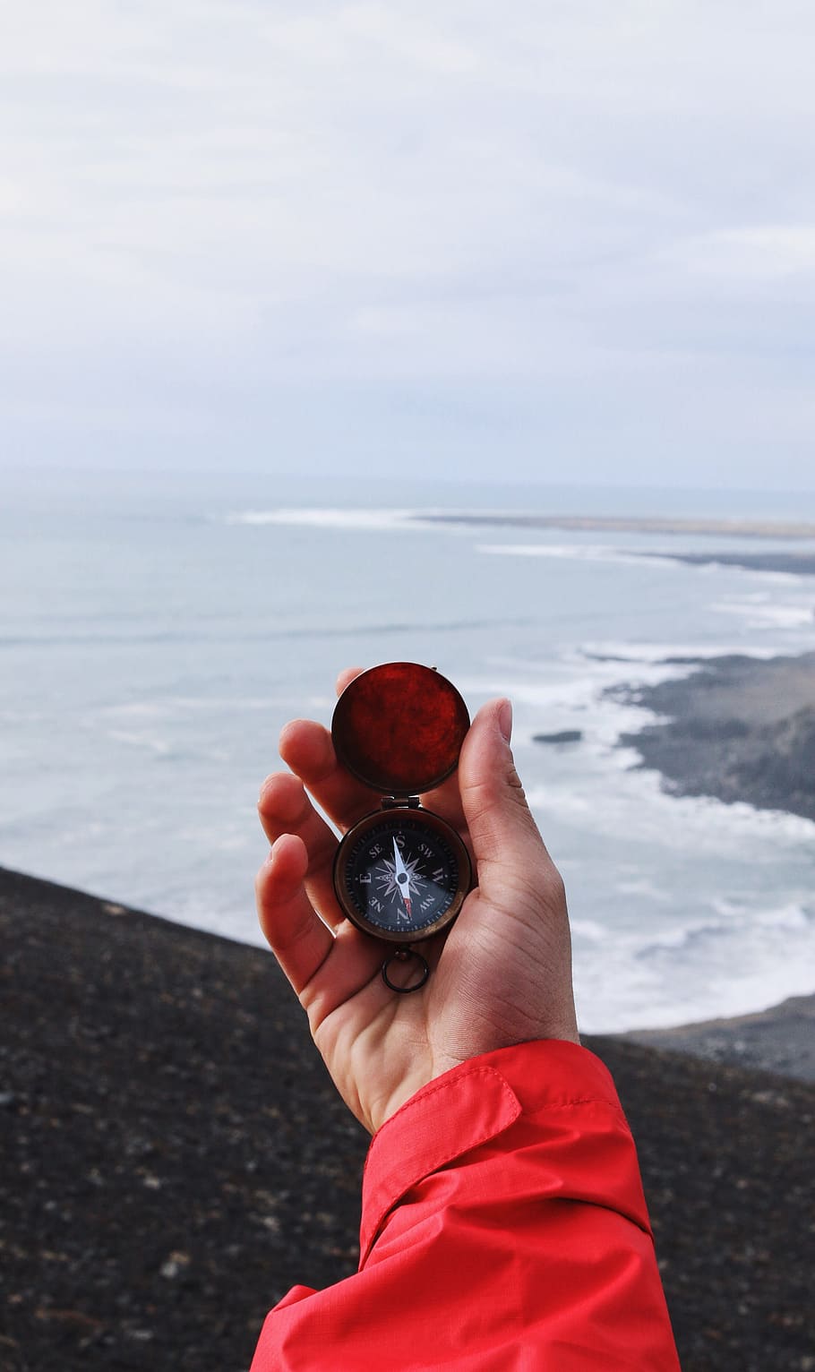 person holding compass, person holding compass pointing at north HD wallpaper