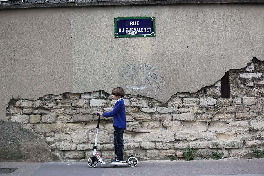 boy in blue long-sleeved shirt standing on kick scooter, child HD wallpaper