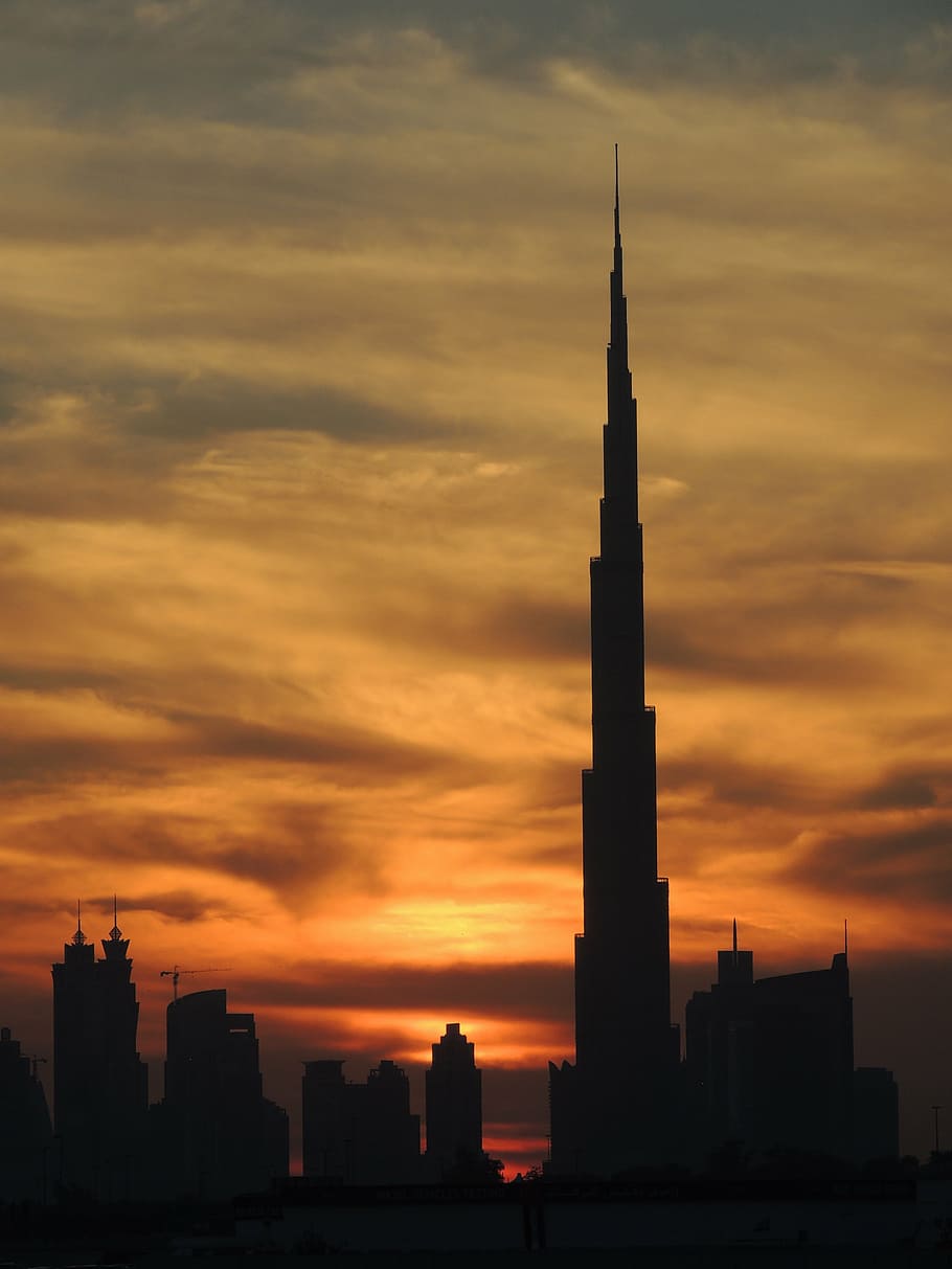 HD wallpaper: silhouette of Burj Khalifa in Dubai, at the top, reach out,  urban | Wallpaper Flare