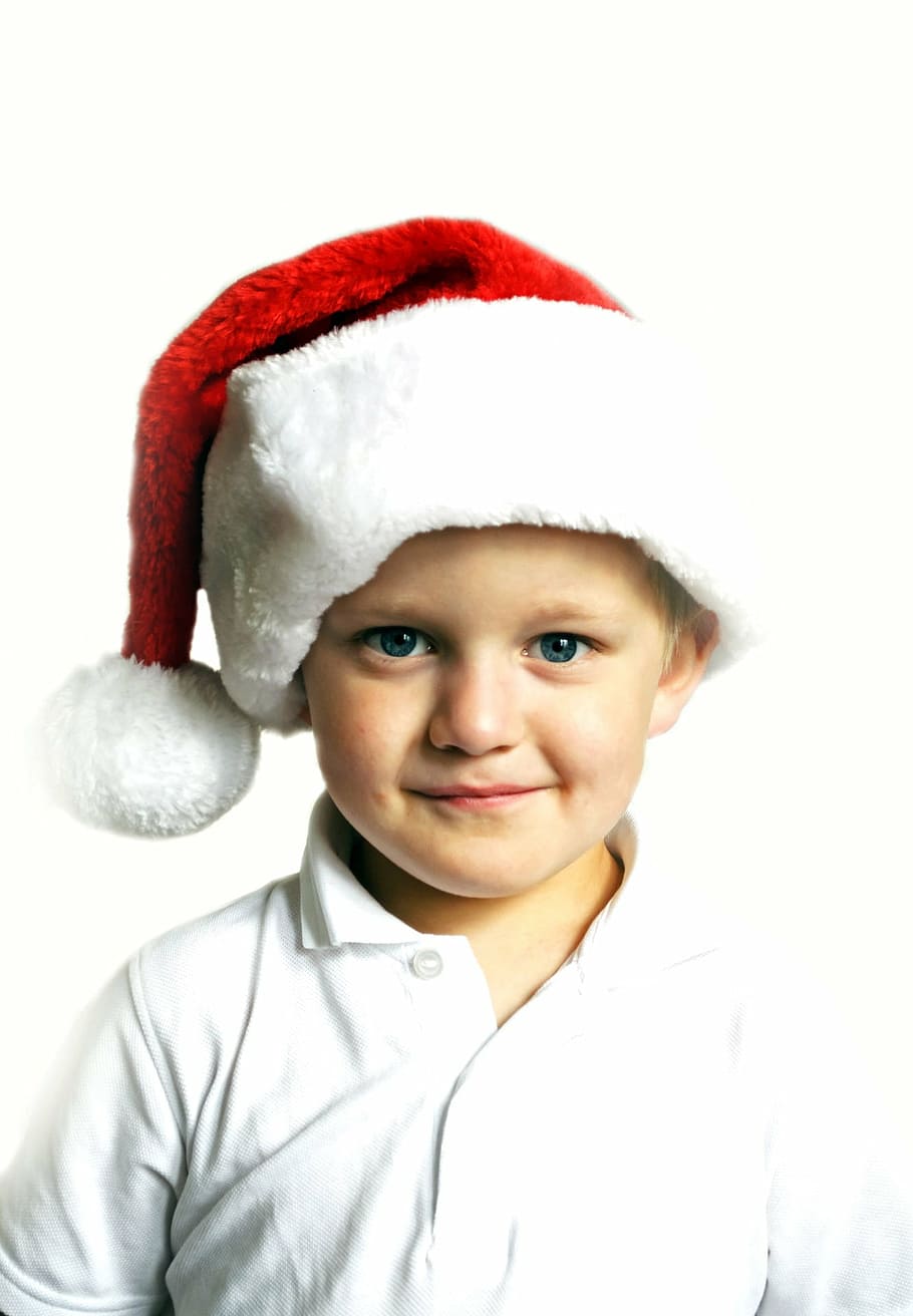 boy in white polo shirt and red Santa cap, christmas, child, kid