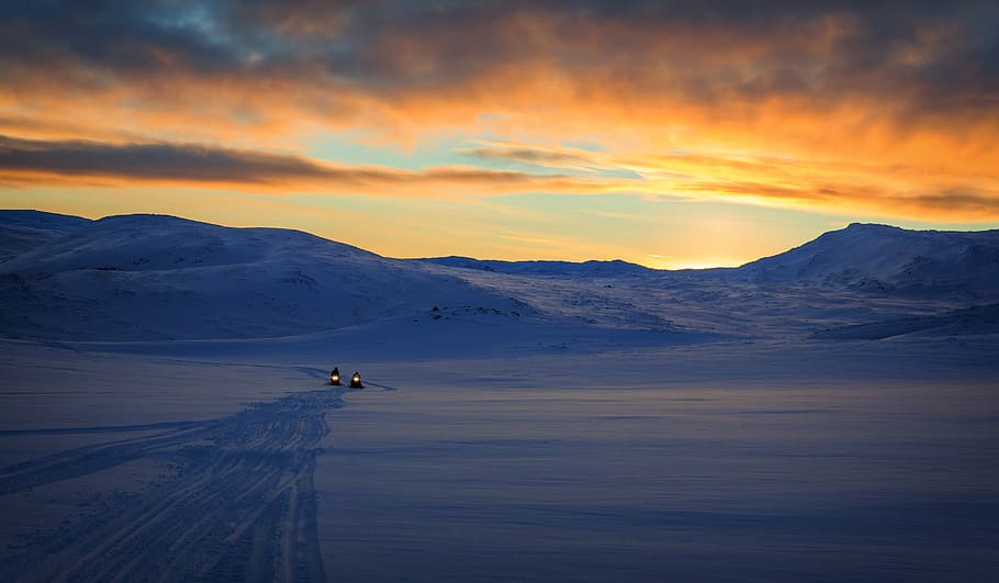 snow capped mountain and field during sunrise, two snow mobile near mountain HD wallpaper