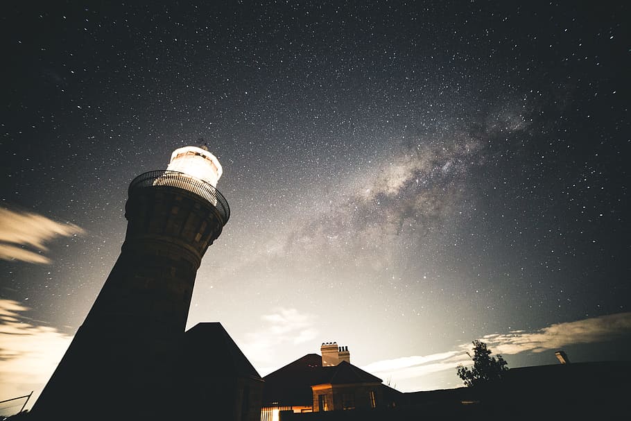 silhouette photography of house beside lighthouse, silhouette of house under starry night HD wallpaper