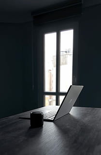 silver laptop computer and black camera lens, silver laptop computer on table HD wallpaper