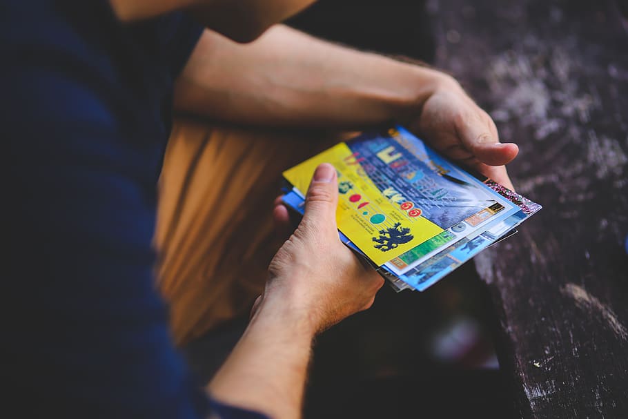 man, viewing, postcards, hands, looking, holidays, currency HD wallpaper