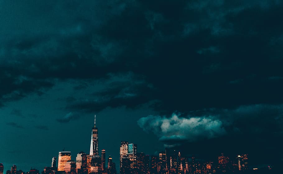 cityscape under black clouds, architecture, building, infrastructure HD wallpaper