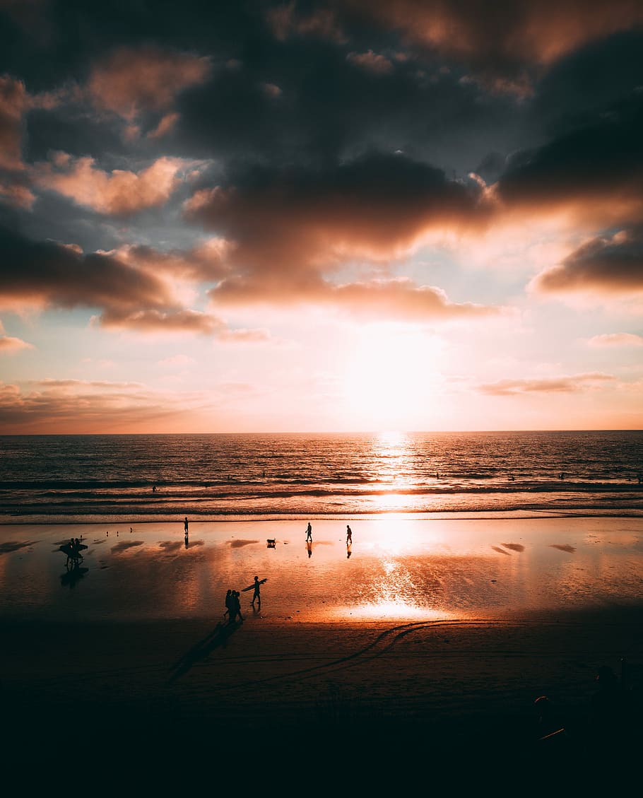 Sunset In LaJolla, group of people on seashore during golden hour HD wallpaper