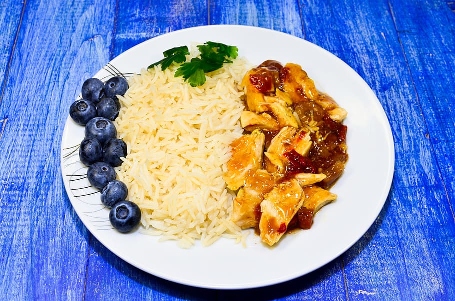 chicken dish and blueberries on white ceramic plage, rice, celery HD wallpaper