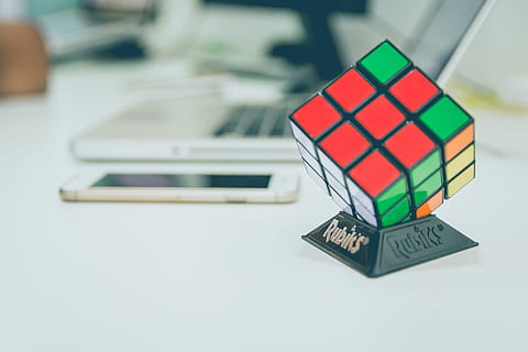 3X3 Rubik's cube on top of desk, 3x3 Rubik's cube on white table HD wallpaper
