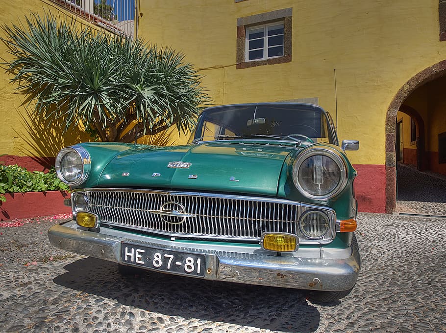 vintage green car parked in front of yellow building during daytime HD wallpaper
