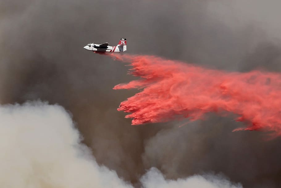 Phoscheck drop - Springs Fire (climate reality), white and red airplane dropping red ash on the sky HD wallpaper