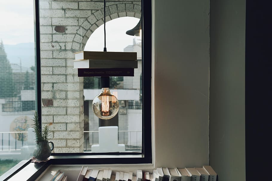 clear glass pendant lamp inside white and brown concrete room during daytime, clear pendant lamp near glass window HD wallpaper
