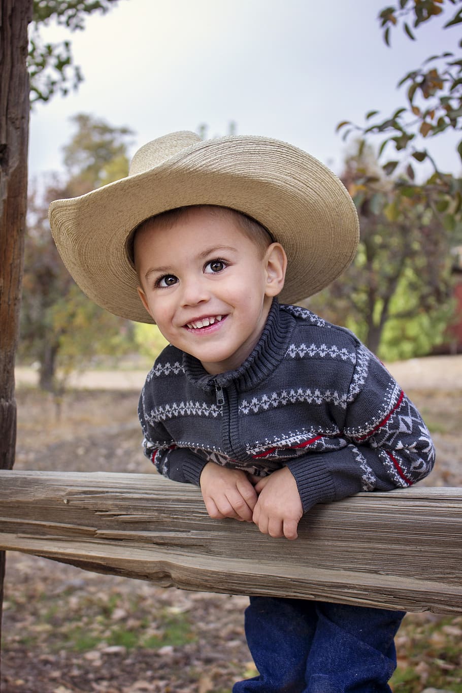 boy wearing brown cowboy hat, child, fun, people, cute, happy