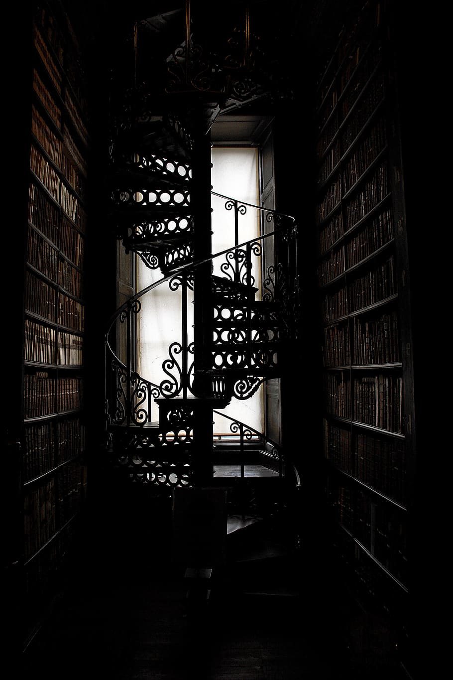 black steel spiral staircase, stairs, trinity college, library