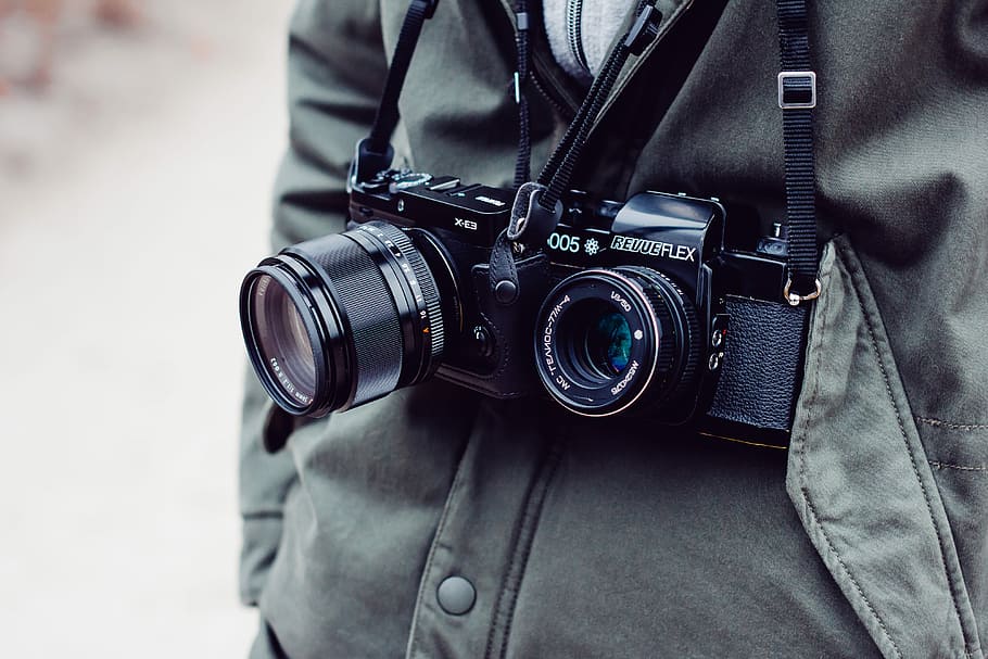 person with two black DSLR cameras, black camera, lens, strap HD wallpaper