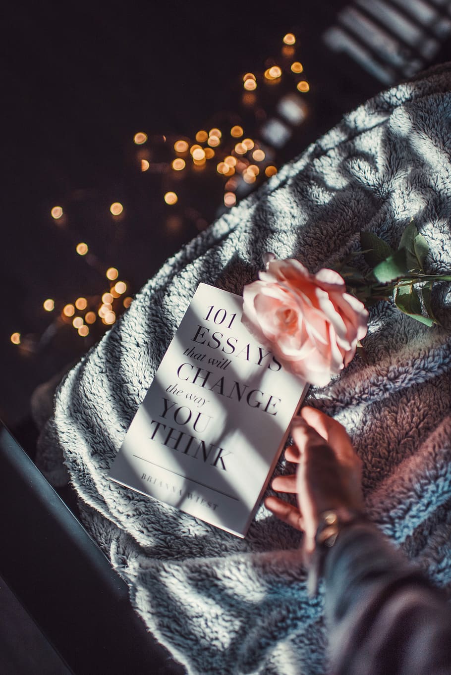 book and peach flower on gray textile, 101 essays that will change the way you think book HD wallpaper
