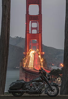 black touring motorcycle with San Francisco bridge on background, black cruiser motorcycle in front of Golden Gate Bridge HD wallpaper