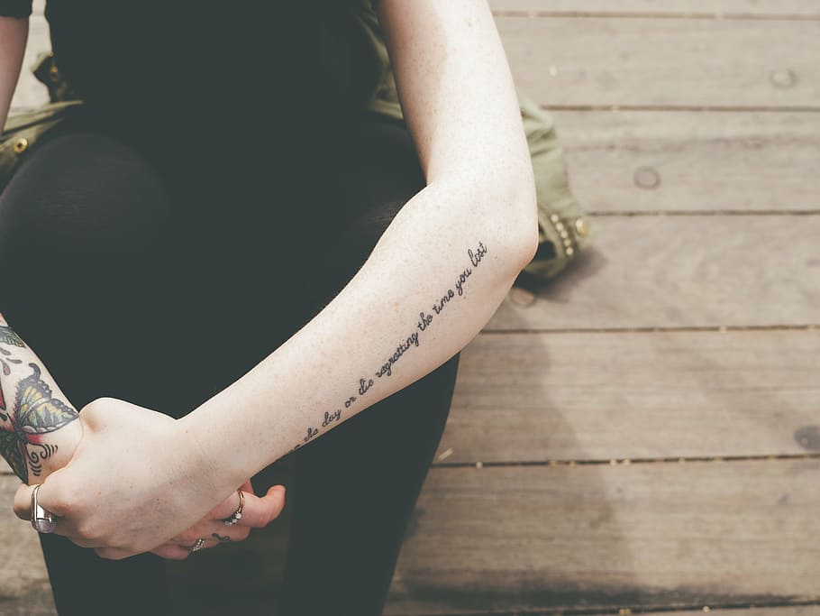 arm tattoo writing