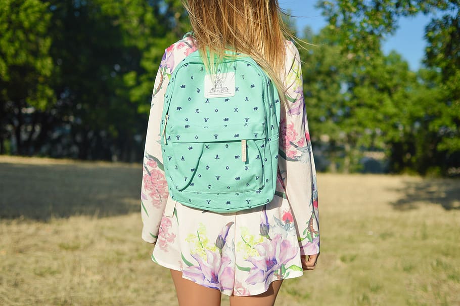 woman in white and multicolored floral long-sleeved mini dress with green backpack, woman carrying blue bag, HD wallpaper