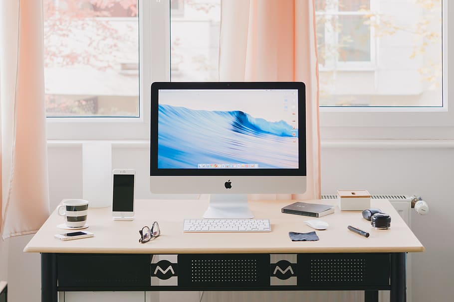 turned silver iMac, white iMac on beige and black wooden table HD wallpaper