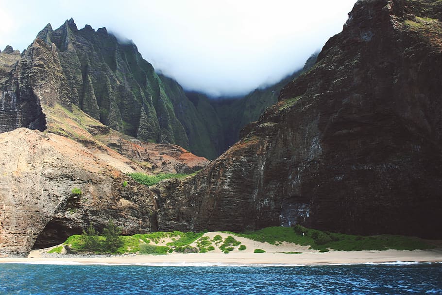 beach near mountains, landscape photography of mountain, rock HD wallpaper