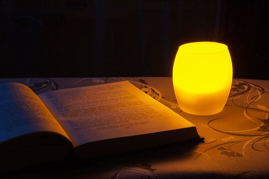 softbound book near yellow desk lamp inside room, Night, Reading