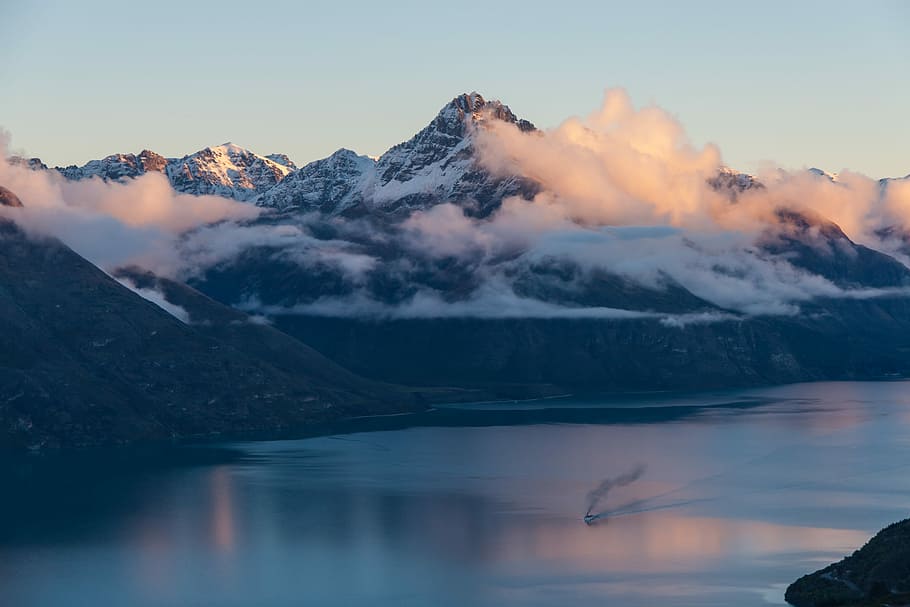 lake beside mountain, ocean near mountain under white sky, cloud HD wallpaper