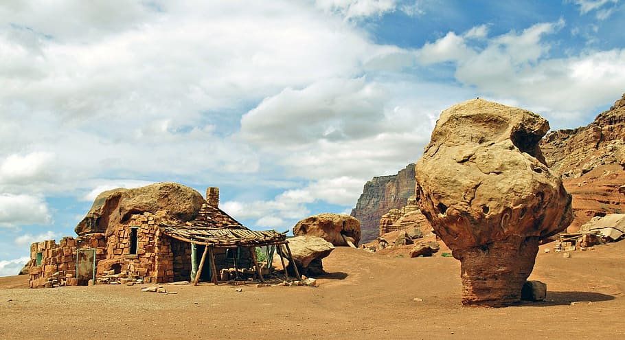 rock formation on desert during daytime, native, shelter, red