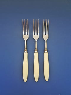 three silver forks on blue surface, background, board, brown HD wallpaper