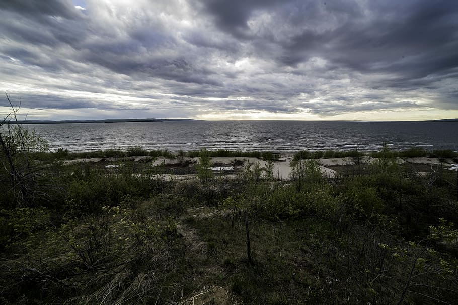 Scenic landscape under the clouds at Lesser Slave Lake, alberta HD wallpaper