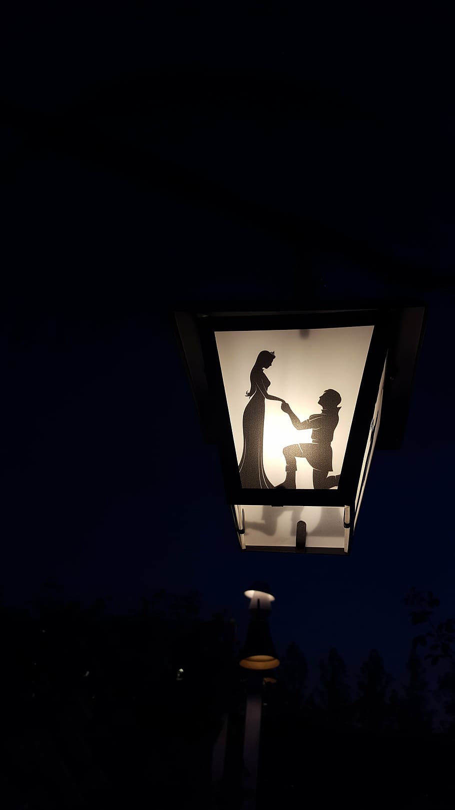 photo of black outdoor lamp with woman and man shade, fairytale HD wallpaper