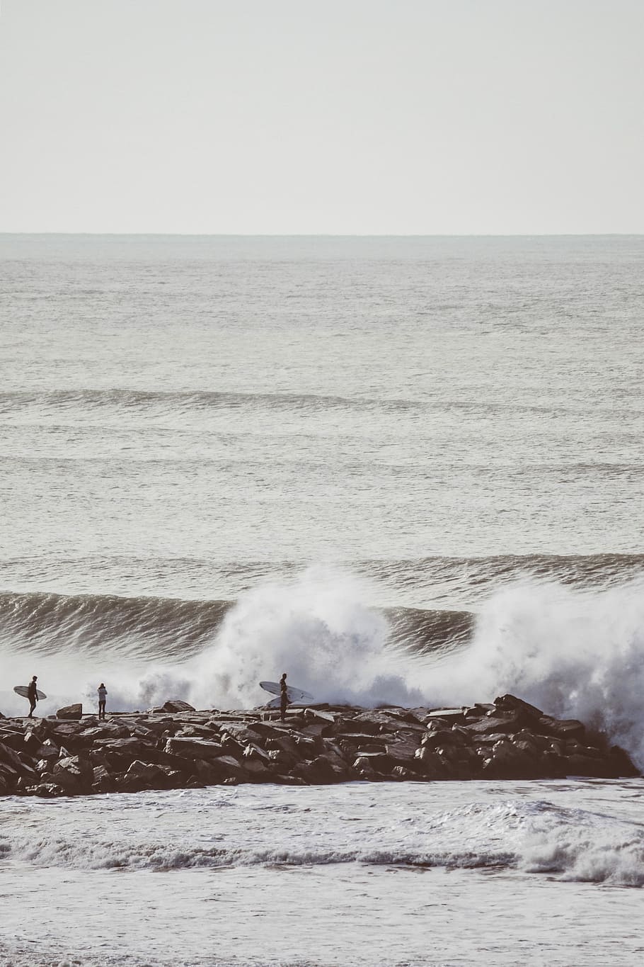 sea waves during daytime, surfers on gay concrete dock, seaside HD wallpaper