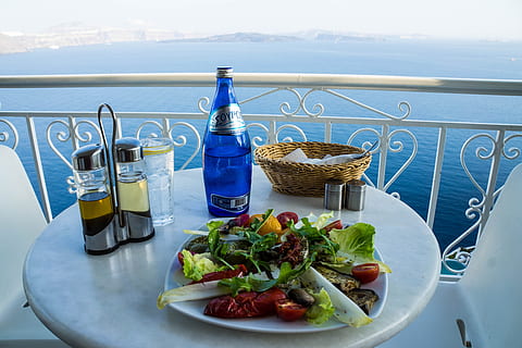 photo of table with vegetable salad near blue bottle, basket, and cruets HD wallpaper