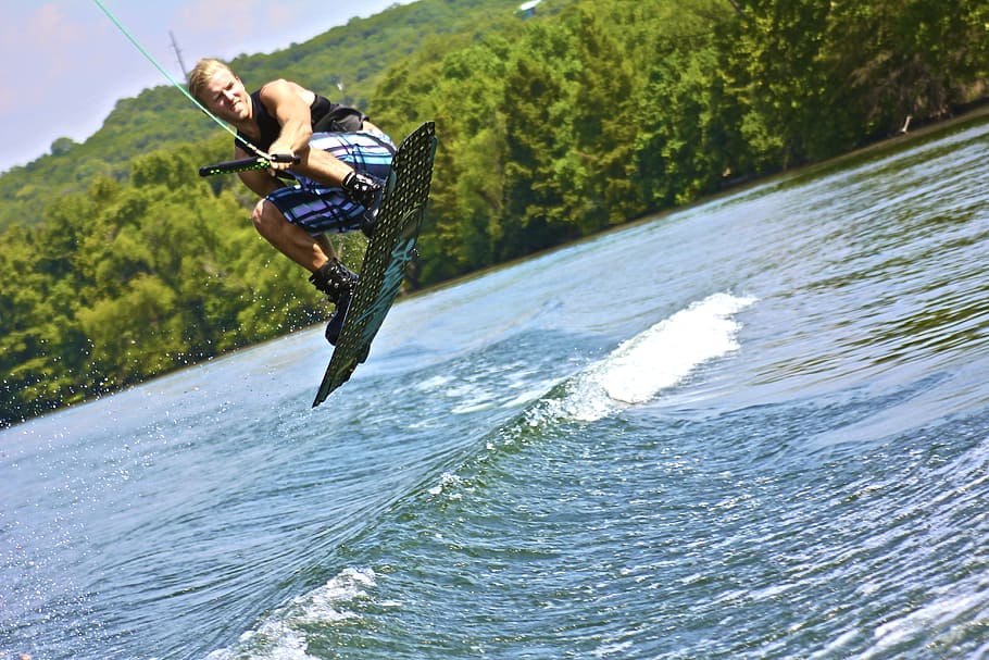 man wakeboarding during daytime, water sports, wake boarding