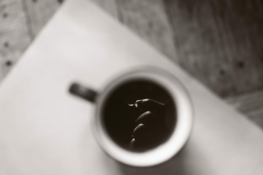 white and black ceramic mug on beige wooden table, white mug filled with black liquid HD wallpaper