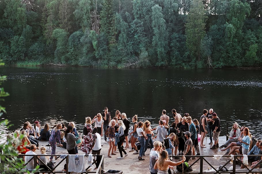 people standing beside lake, people on wooden platform on body of water with trees in the background HD wallpaper