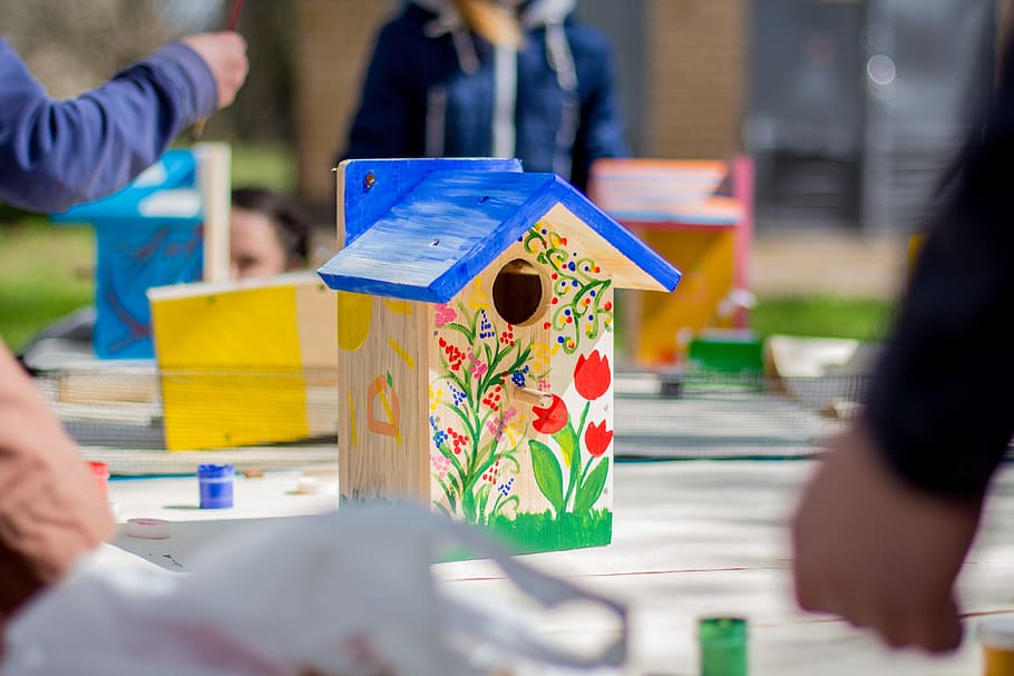 shallow focus photography of birdhouse, brown and blue wooden house with painting flowers decor, HD wallpaper