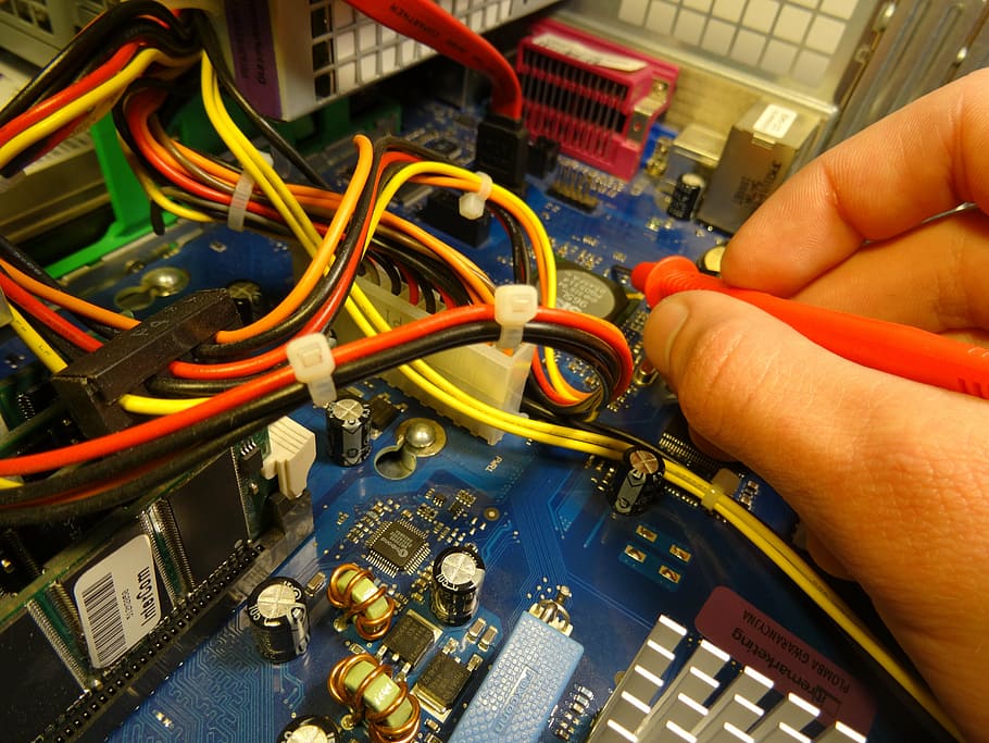 person soldering circuit board, computer, repair, technology