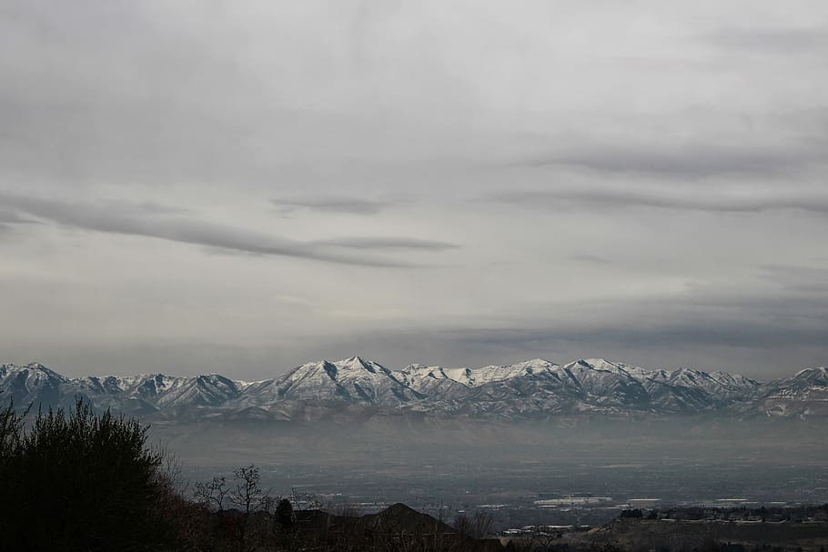 landscape photography of snow coated mountains, snow-covered mountains under cloudy sky HD wallpaper