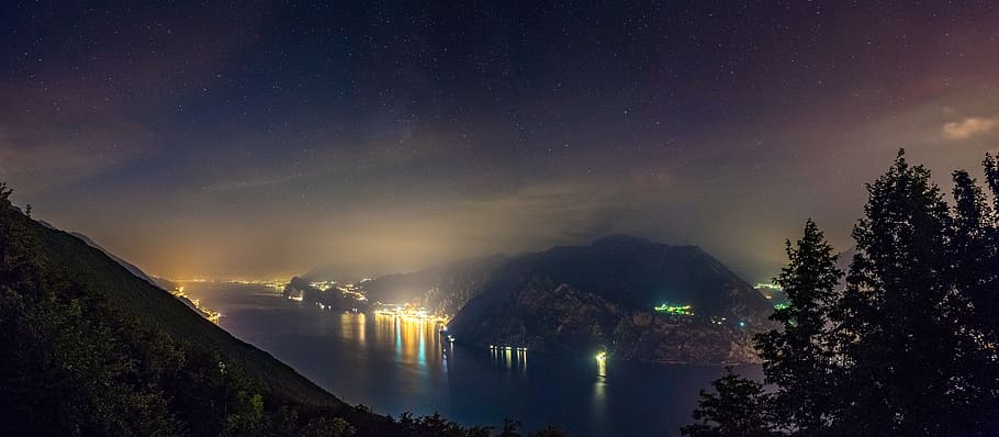 mountain, highland, dark, night, sky, clouds, lake, water, lights HD wallpaper